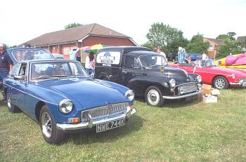 a pair of MGs and a Morris Minor van