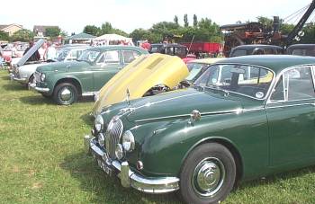 a nice pair of Jags - the open bonnet is an E-type
